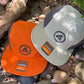 The Shelta Adventurer Cap In Sage and orange