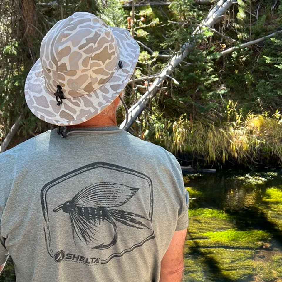 MAN WEARING A SHELTA FALCON LOOKING AT A FOREST