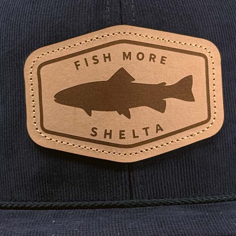 The Shelta Fish More Cap In Navy logo